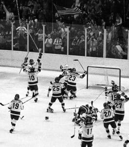 Hockey players celebrating a goal